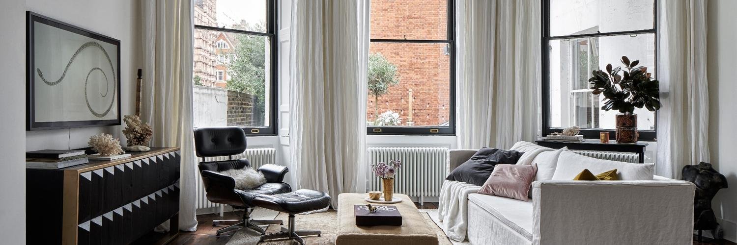 Bright modern apartment living room with minimalist decor and natural light