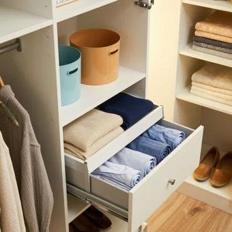 Tidy closet with drawers, shelves, and space-saving clothing organizers