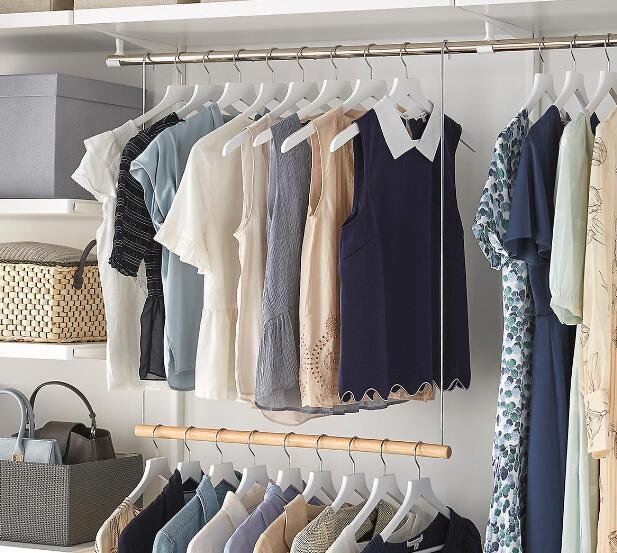 small closet with double hanging rods to maximize vertical space