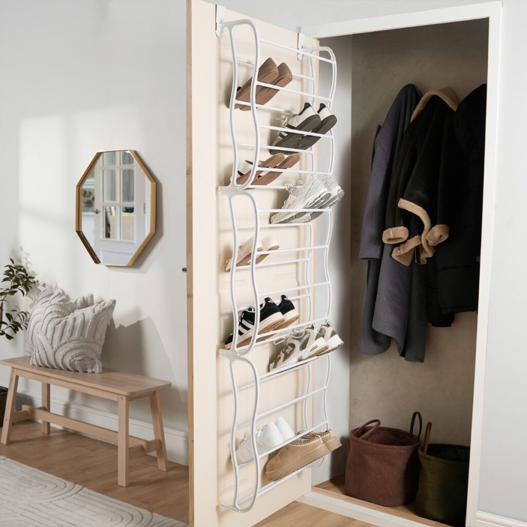 over the door closet organizer storing shoes and accessories in small apartment